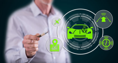Man touching a driverless car concept on a touch screen with a penの写真素材