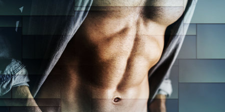 Muscular young man in gray shirt, geometric patternの写真素材
