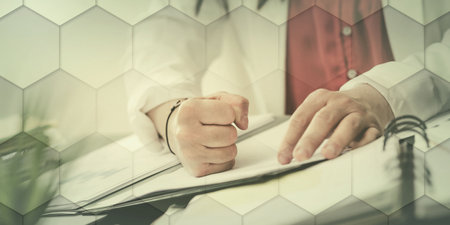 Angry businesswoman hitting her desk with her clenched fist, geometric patternの写真素材