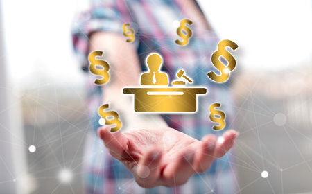 Law concept above the hand of a woman in backgroundの写真素材