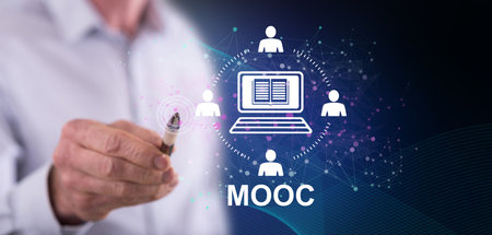 Man touching a mooc concept on a touch screen with a penの写真素材