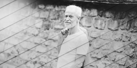 Portrait of handsome mature man, outdoors, geometric patternの写真素材