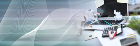Messy and cluttered office desk; panoramic banner