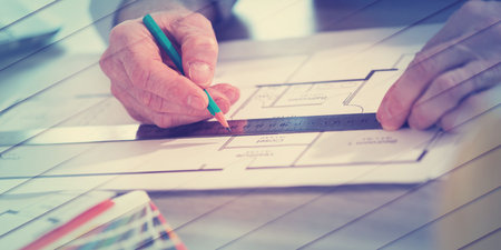 Architect working on a project and using a ruler, geometric patternの写真素材