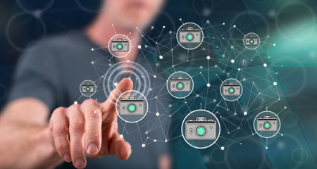 Man touching a photo sharing concept on a touch screen with his finger