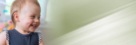 Portrait of happy cute baby girl with a beautiful smile; panoramic bannerの写真素材