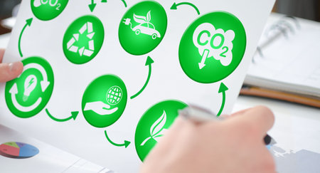 Hands holding a paper showing an ecology concept