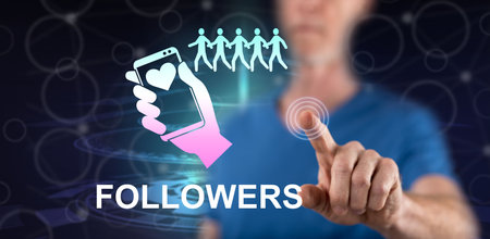 Man touching a followers concept on a touch screen with his fingerの写真素材