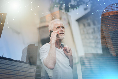 Mature man using his mobile phone outdoors; multiple exposure