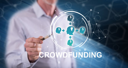 Man touching a crowdfunding concept on a touch screen with a penの写真素材