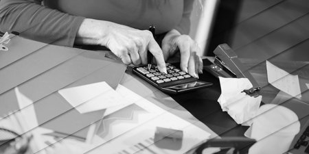 Businesswoman working on a cluttered and messy desk, geometric patternの写真素材