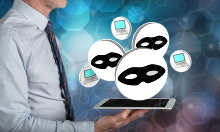 Cyber attack concept above a tablet held by a manの写真素材