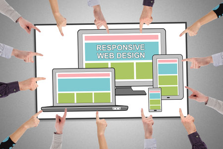 Hands pointing to responsive design conceptの写真素材