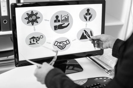 Businesswoman showing business support concept on a computer screenの写真素材