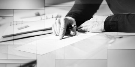 Senior businessman reviewing terms of contract at office, geometric pattern
