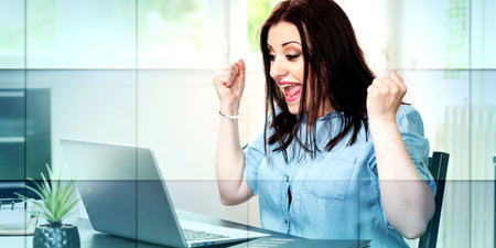 Young attractive woman getting good news on laptop, geometric patternの写真素材