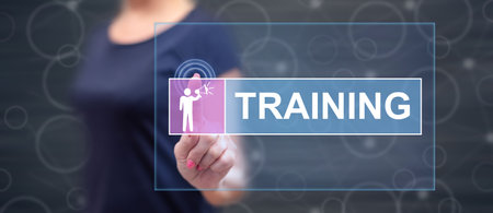Woman touching a training concept on a touch screen with her fingerの写真素材