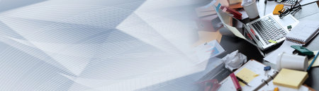 Messy and cluttered office desk; panoramic bannerの写真素材