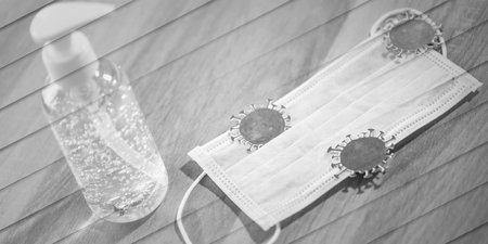 virus on medical face mask and sanitizer alcohol gel bottle; concept of protection against virus, geometric patternの写真素材