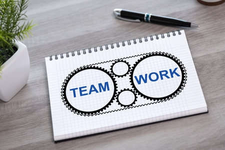 Teamwork concept drawn on a notepadの写真素材