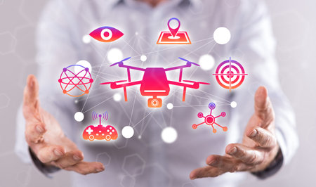 Drone concept above the hands of a man in backgroundの写真素材