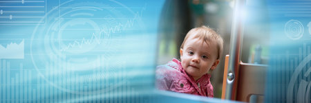 Cute baby girl having fun on a playground; panoramic bannerの写真素材