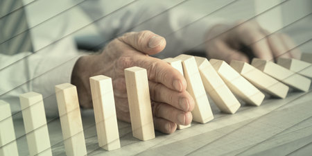 Business control concept by stopping domino effect, geometric patternの写真素材