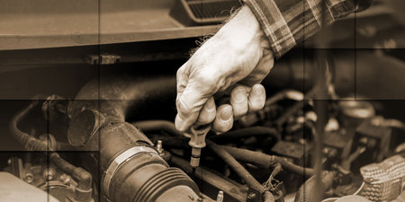 Car mechanic checking a car engine, geometric patternの写真素材
