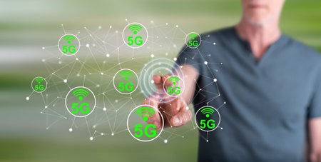 Man touching a 5g concept on a touch screen with his fingerの写真素材