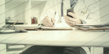 Doctor taking an appointment at his office, geometric patternの写真素材