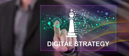 Man touching a digital strategy concept on a touch screen with his fingerの写真素材