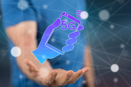 5g concept above the hand of a man in backgroundの写真素材