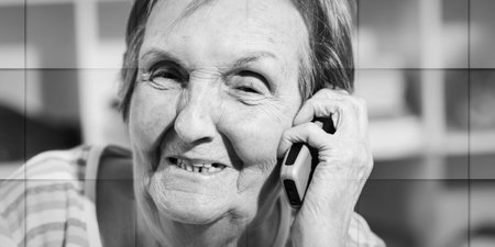 Senior woman using her phone, geometric patternの写真素材