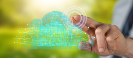 Man touching a cloud networking concept on a touch screen with his finger
