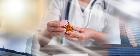 Female doctor looking at a bottle of pills in medical office; multiple exposureの写真素材