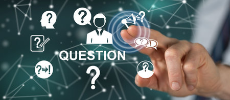 Man touching a question concept on a touch screen with his fingerの写真素材