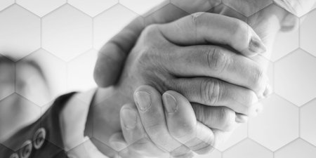 Business handshake, closeup, geometric patternの写真素材