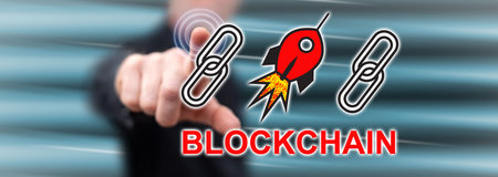 Man touching a blockchain success concept on a touch screen with his finger