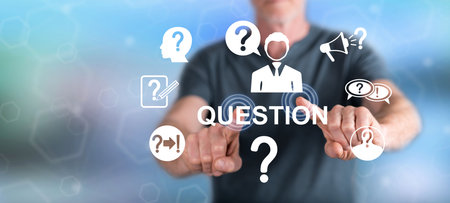 Man touching a question concept on a touch screen with his fingersの写真素材