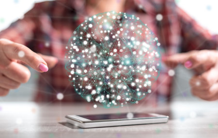 Smartphone with global connection concept between hands of a woman in backgroundの写真素材