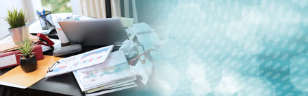 Messy and cluttered office desk; panoramic banner