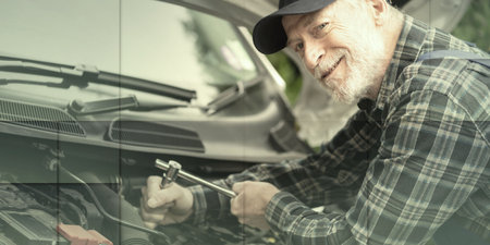 Car mechanic repairing a car engine, geometric patternの写真素材