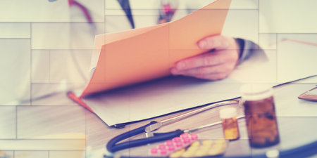 Doctor reading a medical report in office, geometric pattern