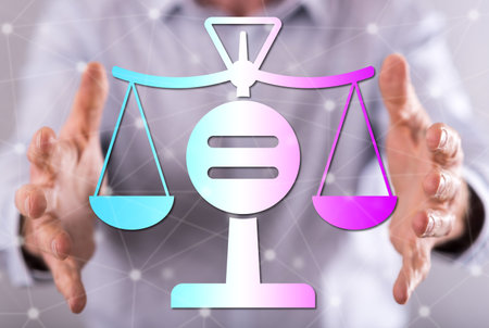 Equality concept between hands of a man in backgroundの写真素材