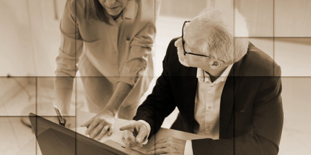 Coworkers having a business discussion in office, geometric pattern