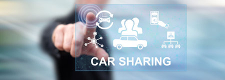 Man touching a car sharing concept on a touch screen with his fingerの写真素材
