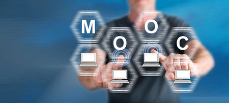 Man touching a mooc concept on a touch screen with his fingersの写真素材