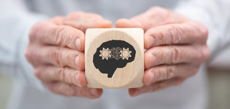 Hand holding a wooden cube with symbol of deep learning concept