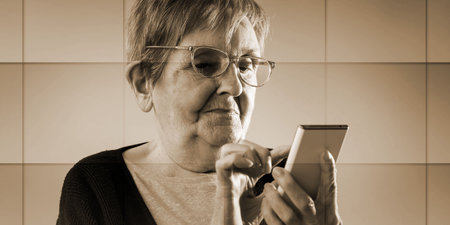 Elderly woman using her smartphone, geometric pattern