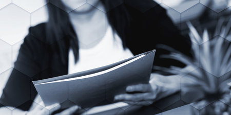 Businesswoman holding folder with paper documents, geometric patternの写真素材